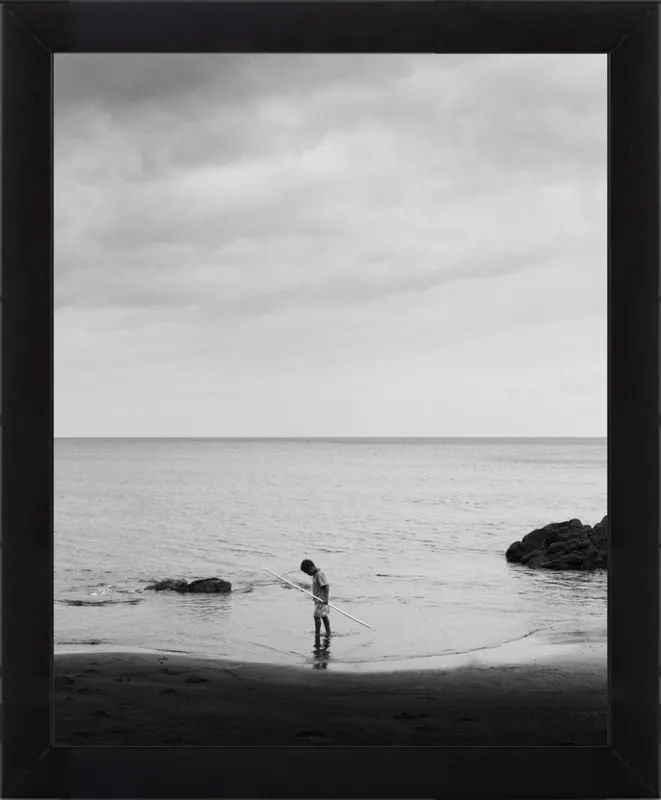 Boy holding stick. by Luis Antonio Garcia for Artfully Walls