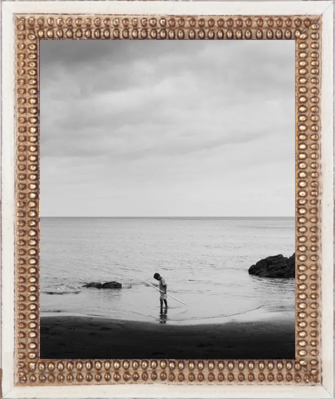 Boy holding stick. by Luis Antonio Garcia for Artfully Walls
