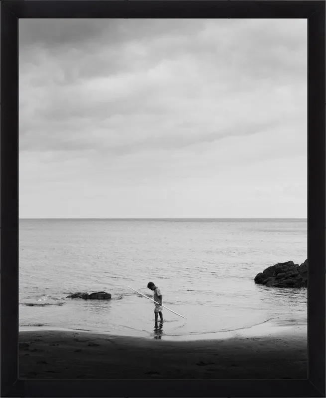 Boy holding stick. by Luis Antonio Garcia for Artfully Walls