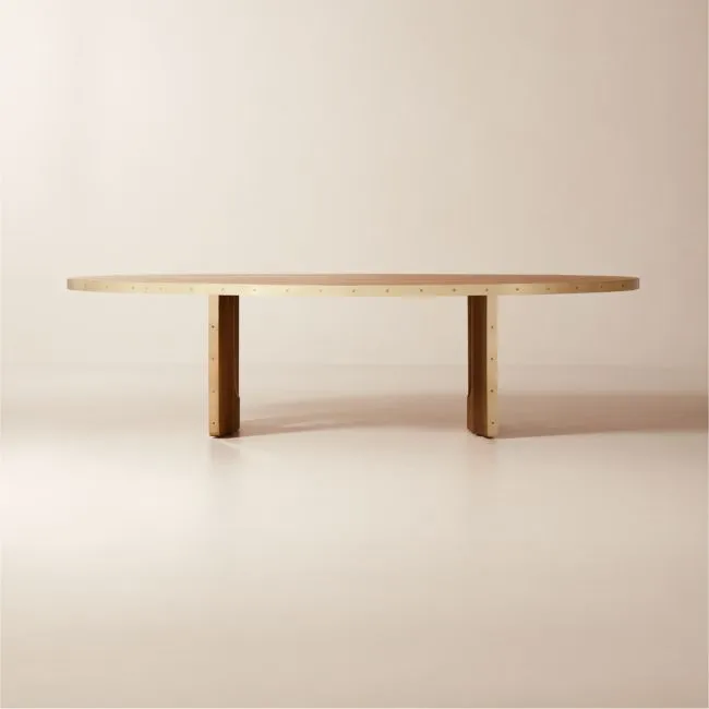 Albertine 110" Oval Oak and Unlacquered Brass Dining Table by goop